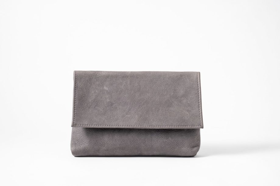 Front view on an upstanding blue-greyish vegetable tanned Leather Clutch with invisible magnet opening